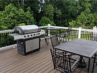 <b>Trex Transcend Spiced Rum Deck Boards with White Washington Vinyl Railing and Black Round Aluminum Balusters in Bowie MD</b>